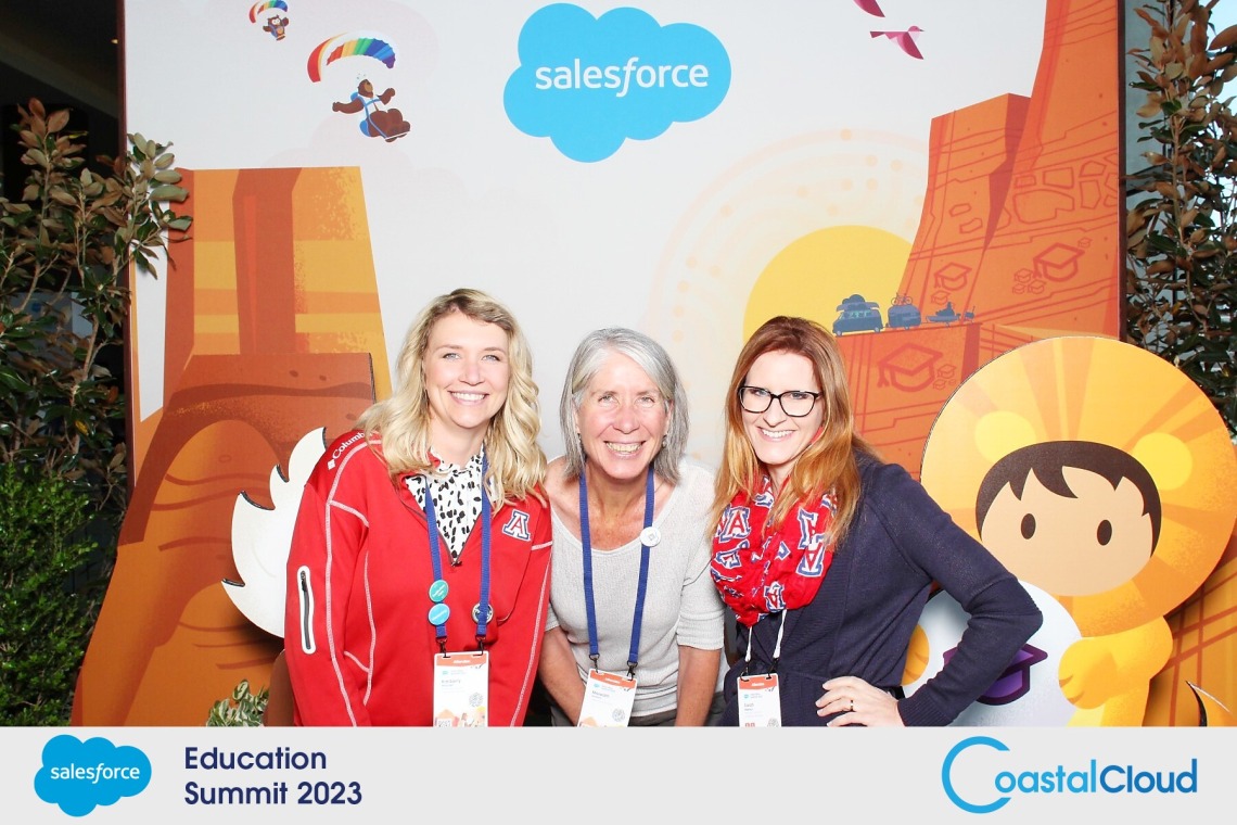 Trellis team poses in front of Salesforce education summit backdrop
